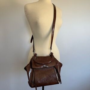 Tory Burch half moon patent leather brown purse with crossbody strap